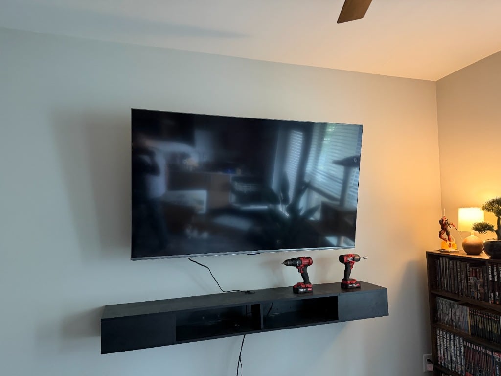 Television mounted above a living-room console